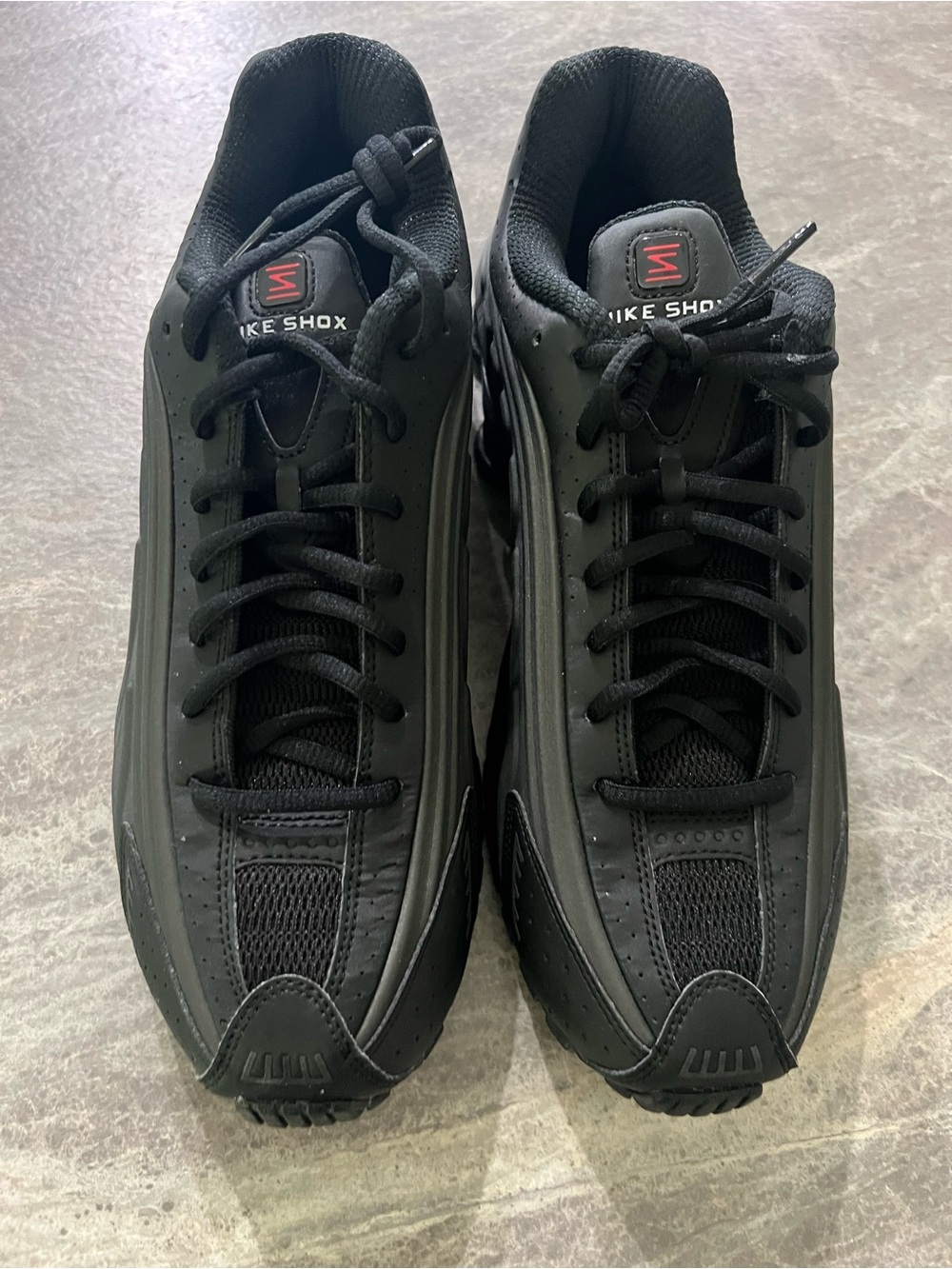 Nike Shox Men’s Black Athletic Shoes with Red Logo Accent